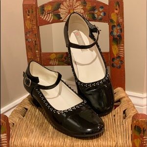 Little girl’s patent leather Mary Jane shoes